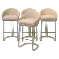 Set of Four Lion in Frost Upholstered Lucite and Brass Swivel Bar Stools, Signed