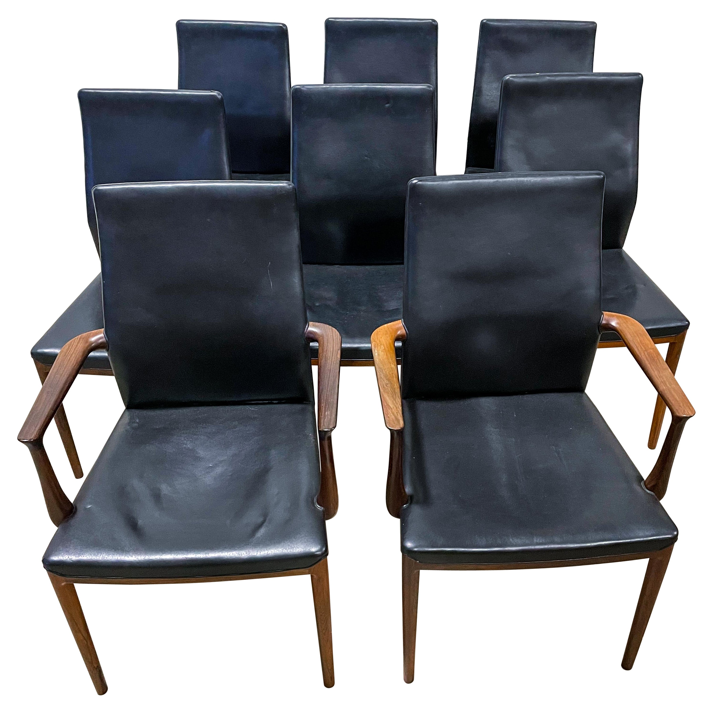 Very rare solid rosewood dining chairs made by Soren Horn and designed by Helge Vestergaard Jensen. Superbly sculpted arms with seamless joints and excellent leather work, these chairs are a cut above the rest. Sought after due to their super thin
