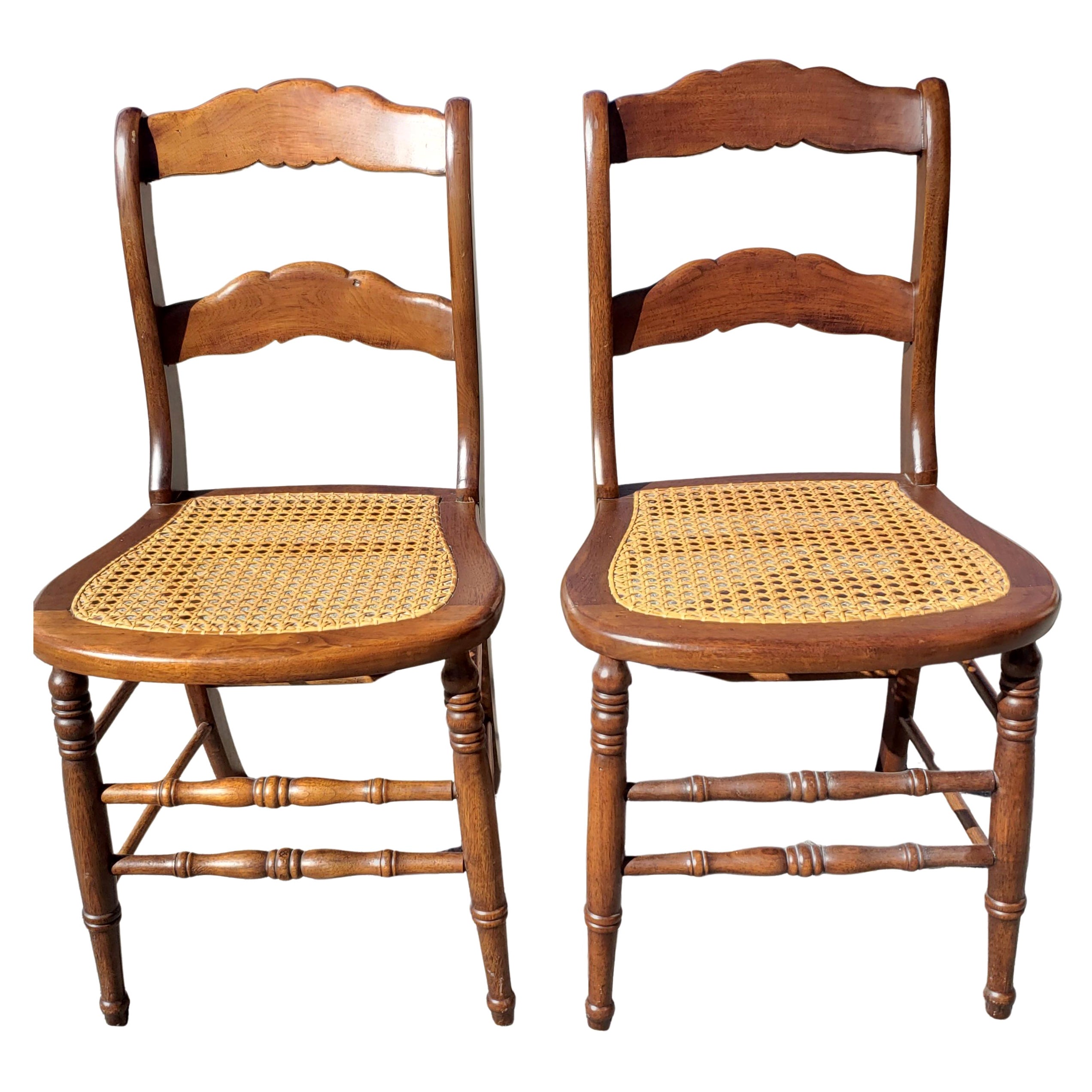 Late 19th Century Americana Cane Seat and Ladder Back Chairs, a Pair
