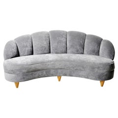 Curved Sofa with Rolled and Tufted Back 