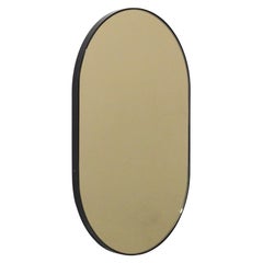 Capsula Capsule shaped Bronze Customisable Mirror with Black Frame, Oversized