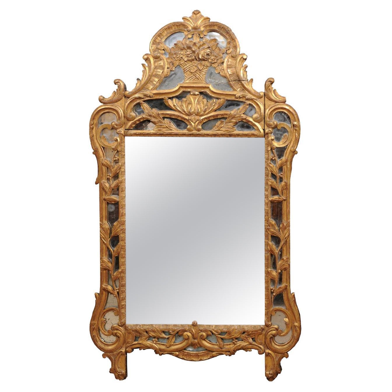 18th Century French Louis XV Giltwood Mirror with Floral Basket Crest For Sale