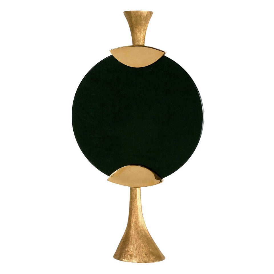 A pair of gilt bronze and glass candlesticks by Aldus (one black, one white. Edition of 100.

A collaboration between Achille Salvagni and Fabio Gnessi, Aldus aims to revive the aesthetic ideals of Greek and Latin philosophy. Functional and