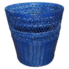 Bright Blue Circular Wicker Basket with Woven Floral Knot Pattern