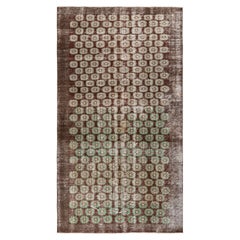 Hand-Knotted Vintage Mid Century Distressed Rug in a Brown, Green Floral Pattern