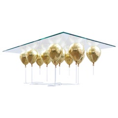 Table basse rectangulaire en forme de ballon en or avec verre 