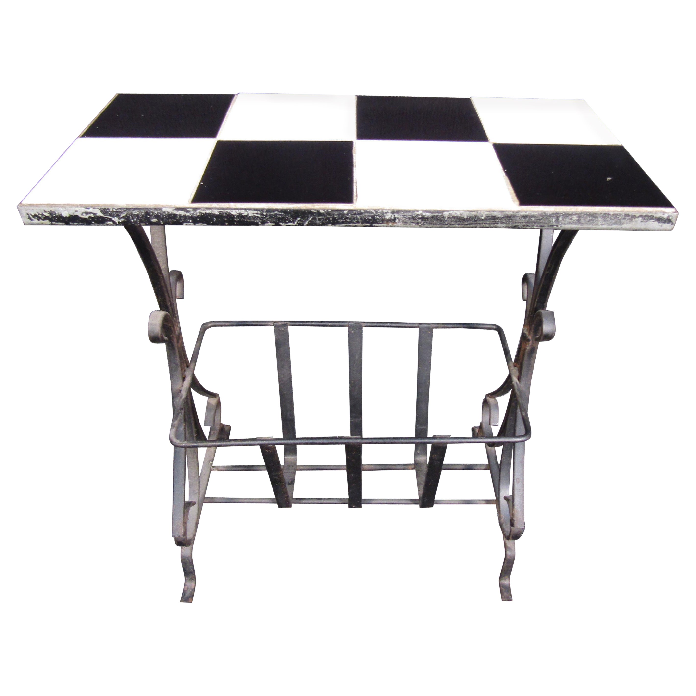 Fun black and white checker top, iron side table with bottom magazine or paper holder. 

(Please confirm item location - NY or NJ - with dealer).
    