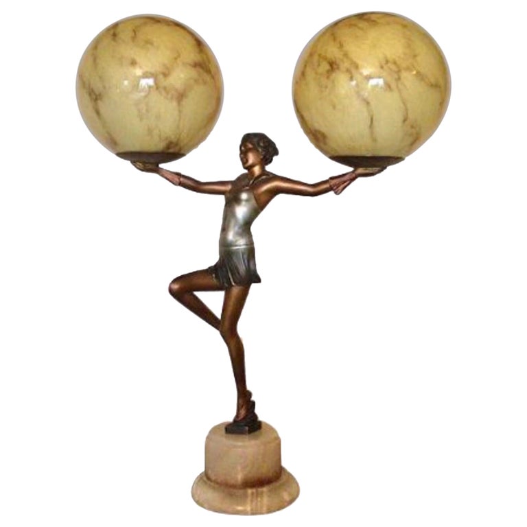 Art Deco Lady Lamp Holding Aloft a Pair of Marbled Globes For Sale