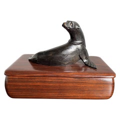 Striking Coromandel Wood Box with a Hand Carved Ebonized Sea Lion Sculpture 1920