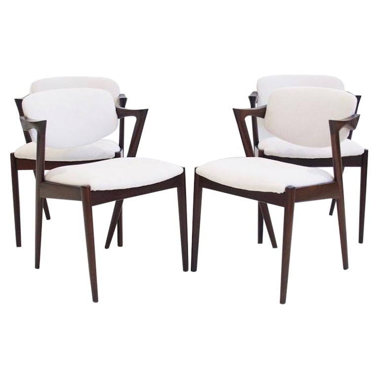 Set of Four Kai Kristiansen Model 42 Chairs with White Upholstery