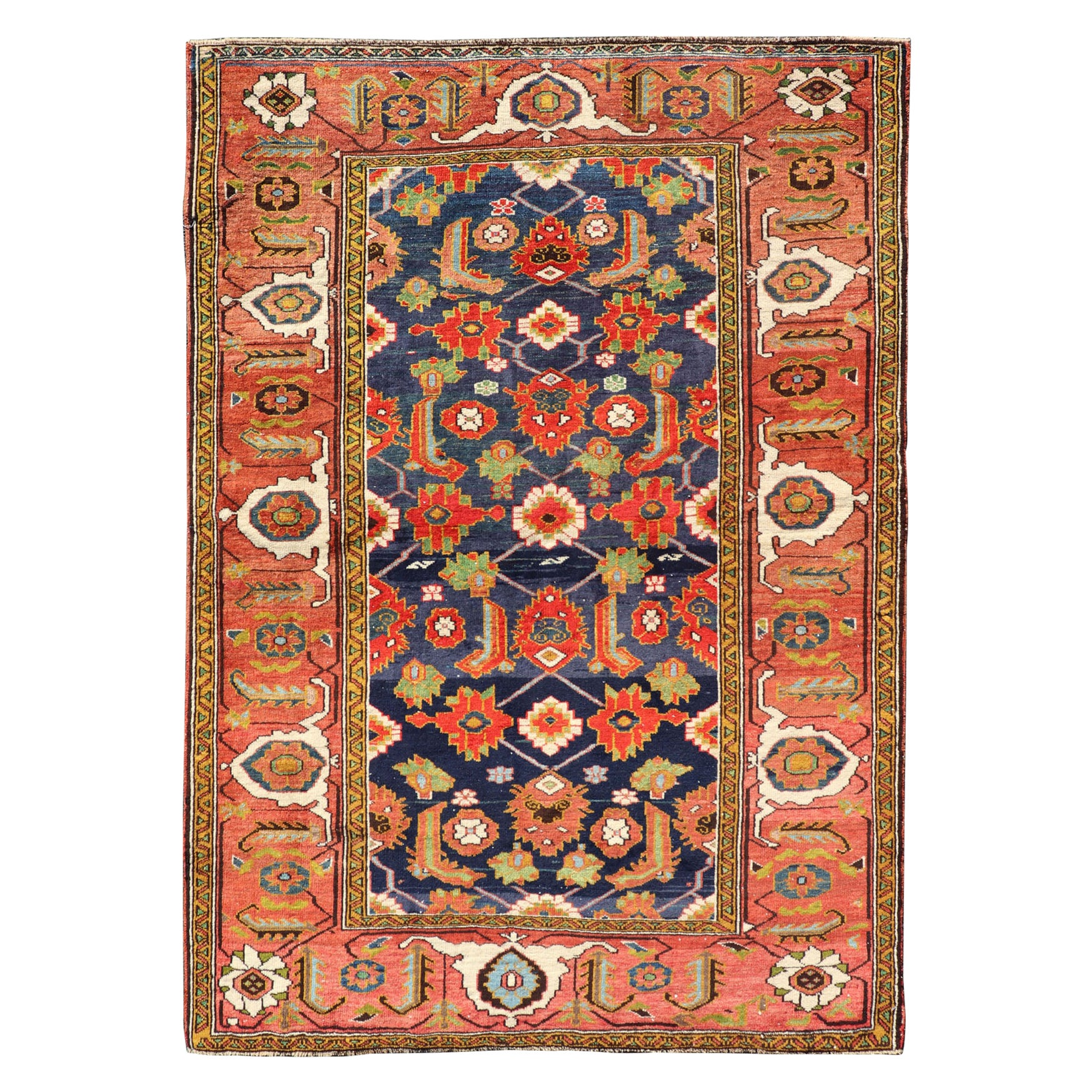Tapis caucasien ancien avec motif sur toute sa surface en bleu royal, rouge et vert doux
