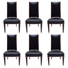 Six Leather Dining Chairs in the style of Andre Arbus