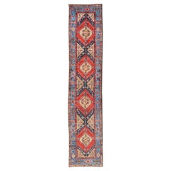Antique Geometric Persian Long Heriz Runner in Red, Blue, Yellow, and Tan