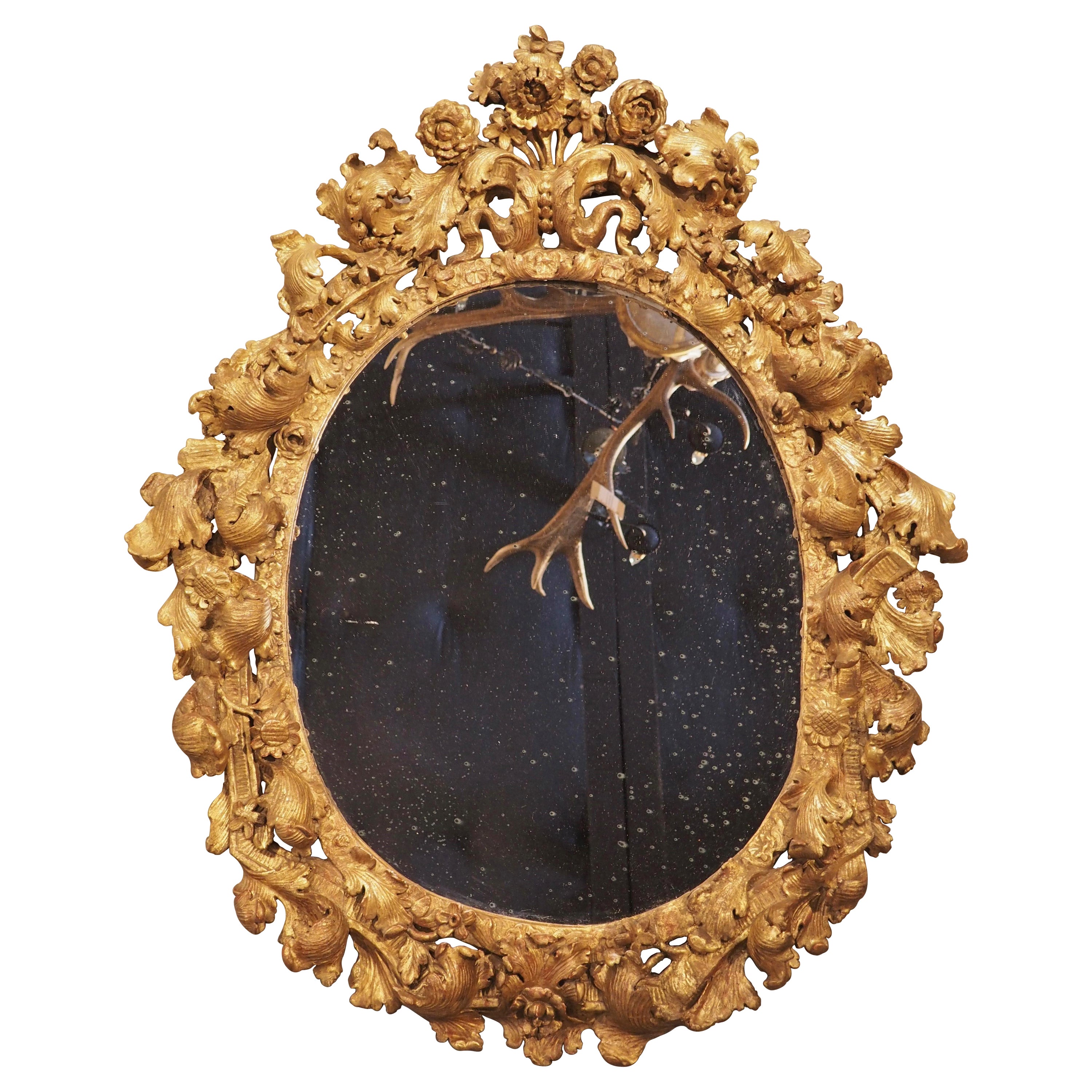 Highly Carved 17th Century Giltwood Mirror from France