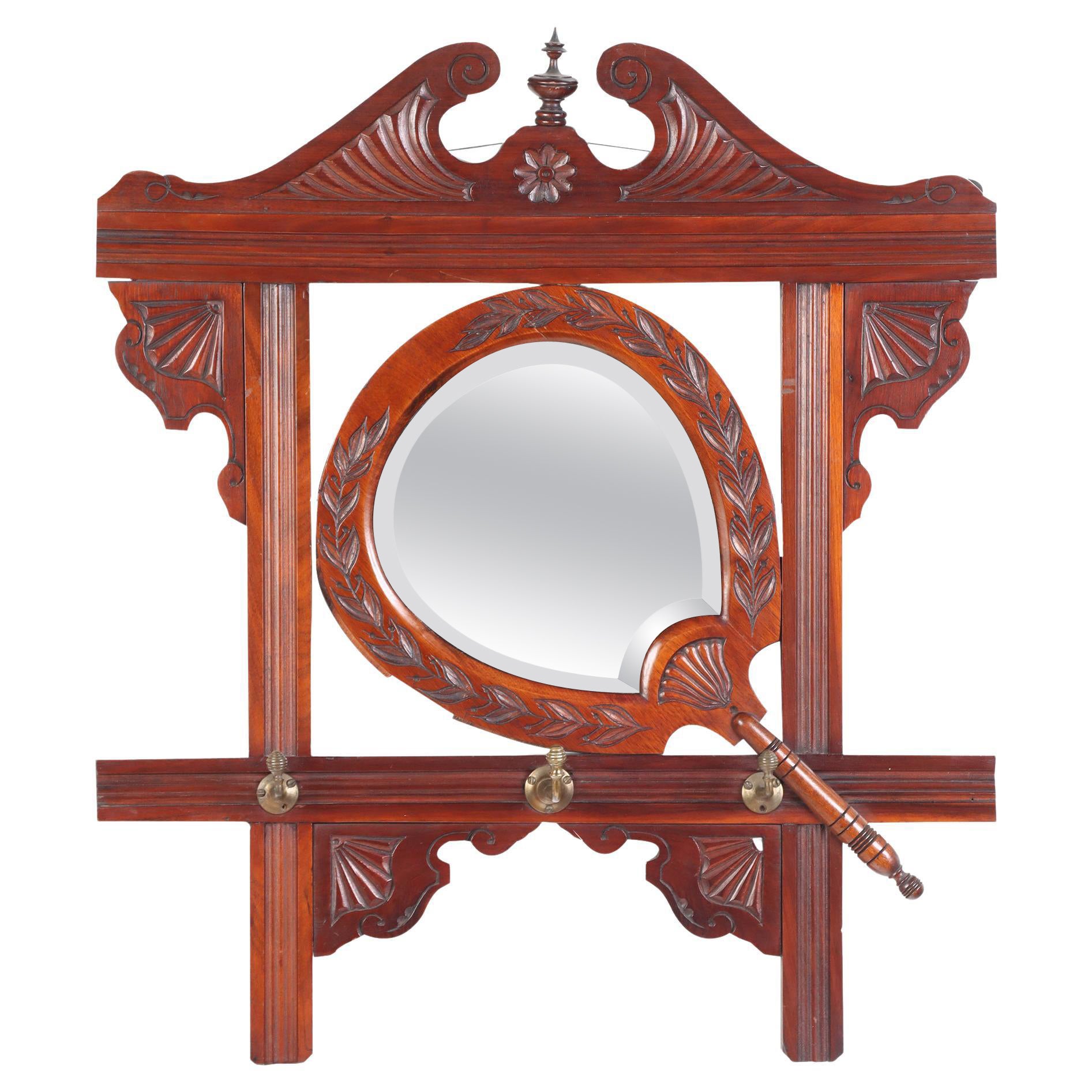 Victorian Carved Mahogany Wall Mirror with Shaped Beveled Mirror circa 1880 For Sale