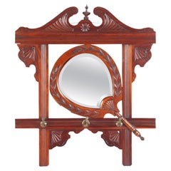 Antique Victorian Carved Mahogany Wall Mirror with Shaped Beveled Mirror circa 1880