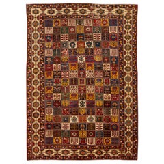 Ancien tapis persan Bakhtiari en laine rouge surdimensionné, fabriqué à la main et à motifs multiples