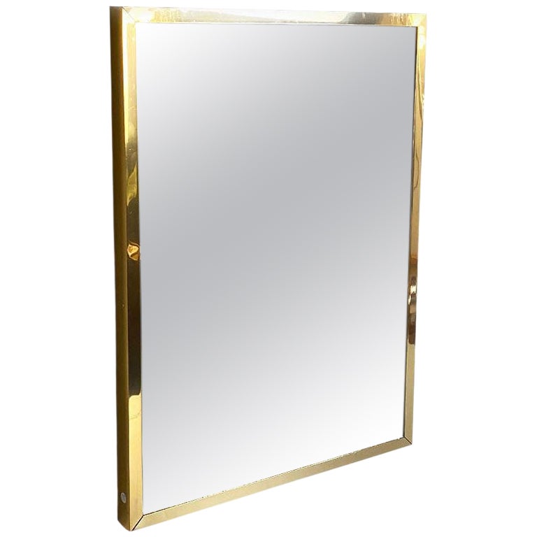 Italian mid-century mirror with brass frame and decorations by Crystal Art 1950s
Mirror on rectangular shaped polished brass frame and glass with golden decorations.
Made by the historical company of Milan Italy Crystal Art, ca.1950.
The mirror have