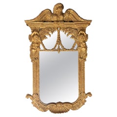 Miroir en bois doré sculpté de style George II