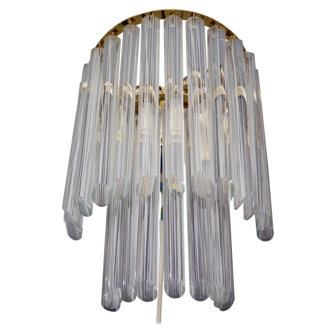 Elegant large wall mount with Murano glass rods on a brass frame. Each clear Murano glass rod includes white stripes, making the glasses shimmer white. Heavy duty. With this light you make a clear statement in your interior design. A real