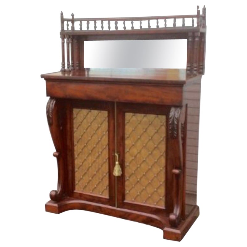 Quality William IV mahogany narrow chiffonier cabinet
Superb spindle gallery and superstructure with mirror.
The single frieze drawer above two grilled cupboard doors with superbly carved scroll supports resting on a concave plinth.
Fantastic
