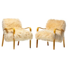 Pair of Vanilla Creme Sheepskin Lounge Chairs with Bentwood Arms by Thonet