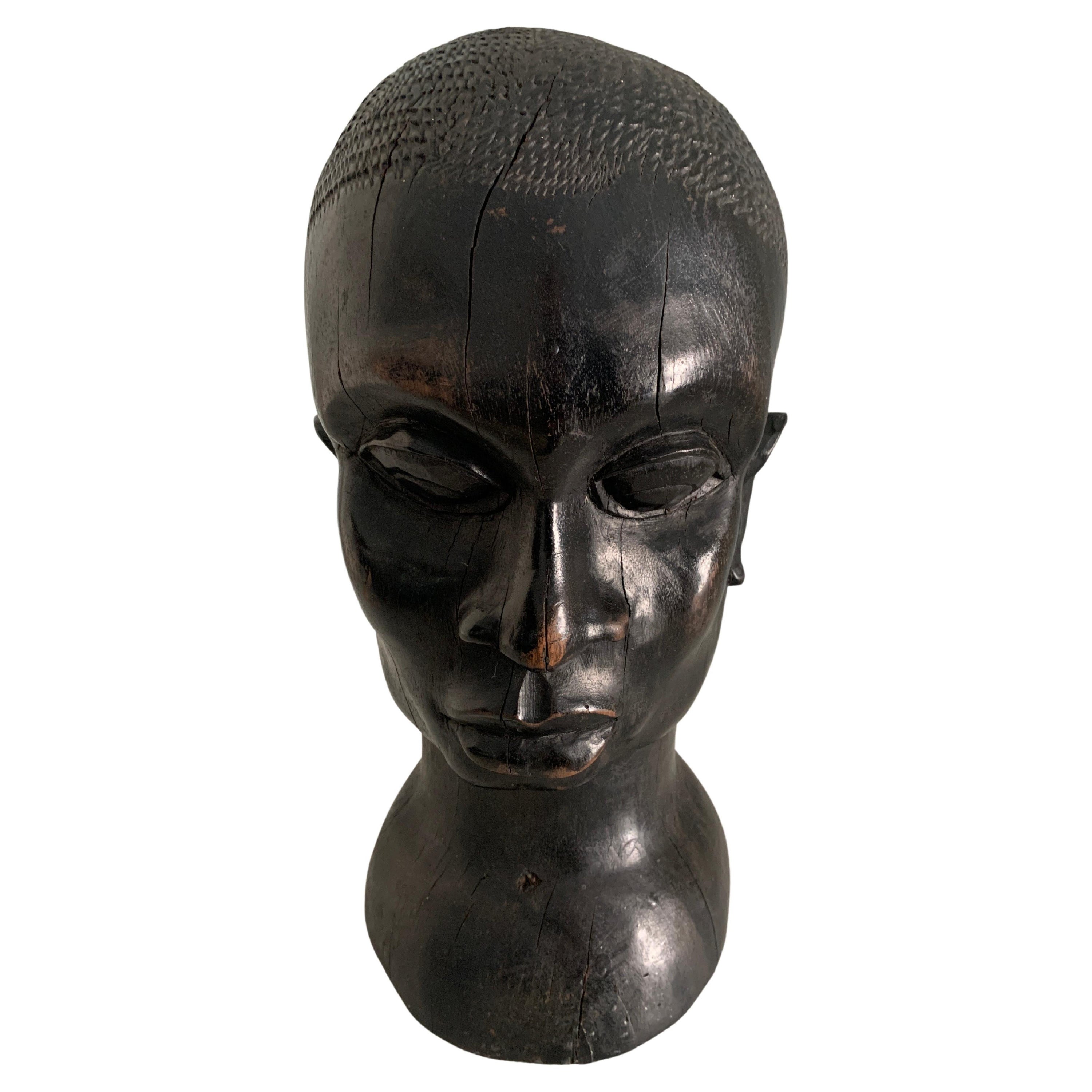 Tête africaine en bois sculpté