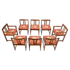 Ensemble de 8 fauteuils de salle à manger en bois de rose massif et tapissés de tissu de lin rouge