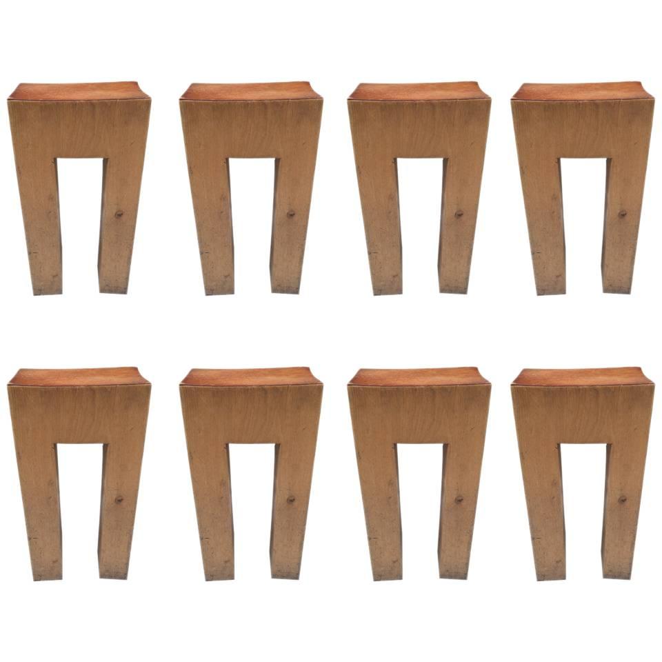 Eight Rare Solid Bar Stools with Leather Seats