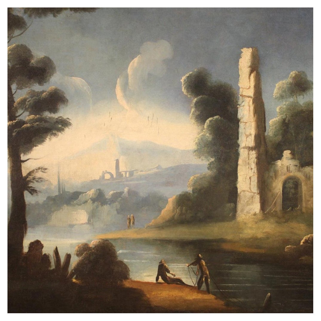 Antiguo cuadro italiano del siglo XVIII. Obra al óleo sobre lienzo que representa un paisaje fluvial con personajes y ruinas de buena calidad pictórica. Marco de madera del siglo XX tallado y dorado con bella decoración. Marco agradablemente