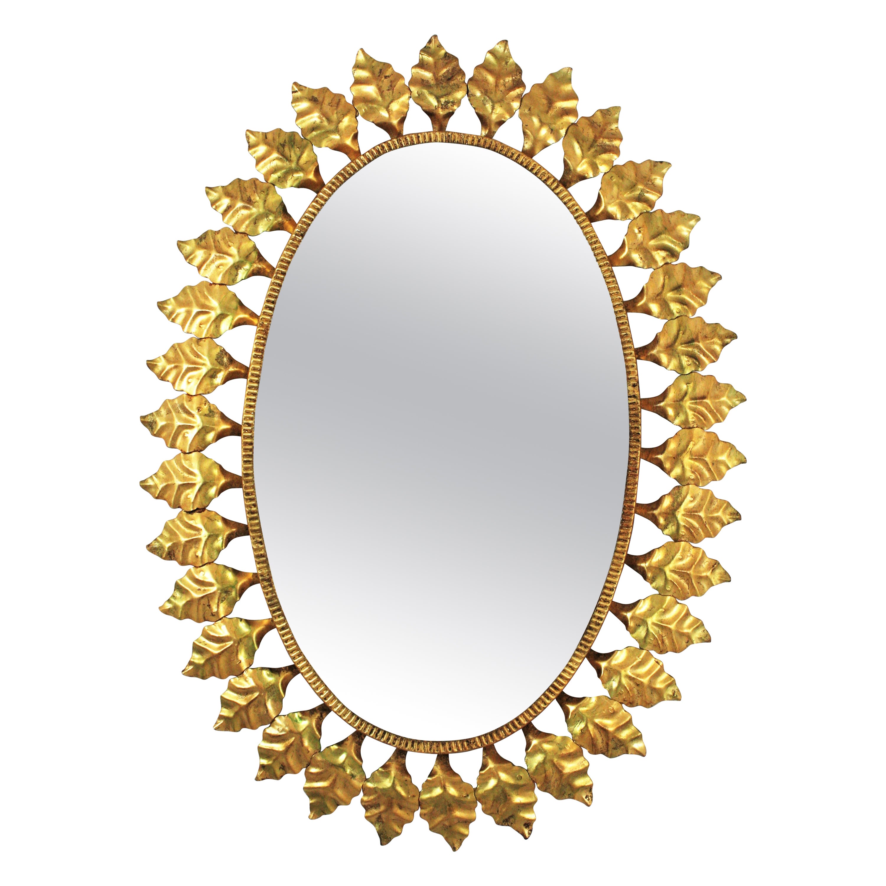 Miroir ovale en fer doré, années 1950