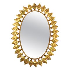 Large Sunburst Oval Mirror in Gilt Iron