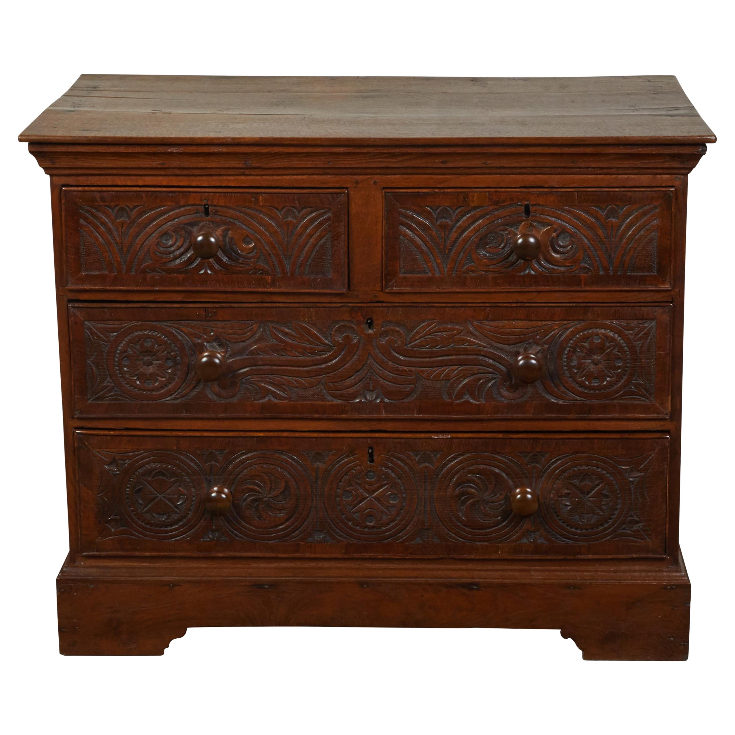 English Georgian Period 1800s Oak Chest with Four Drawers and Carved Motifs For Sale