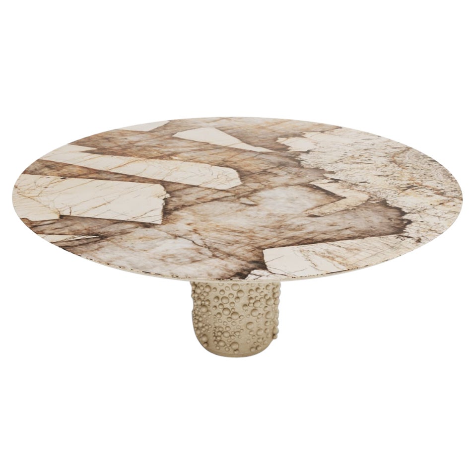 A Modern Patagon 6-Seat Round Dining Table by Covet House, a circular Patagonian marble top is the culmination of this homage, while the champagne lacquered foot represents the region’s individuality and natural beauty. This round dining table gives