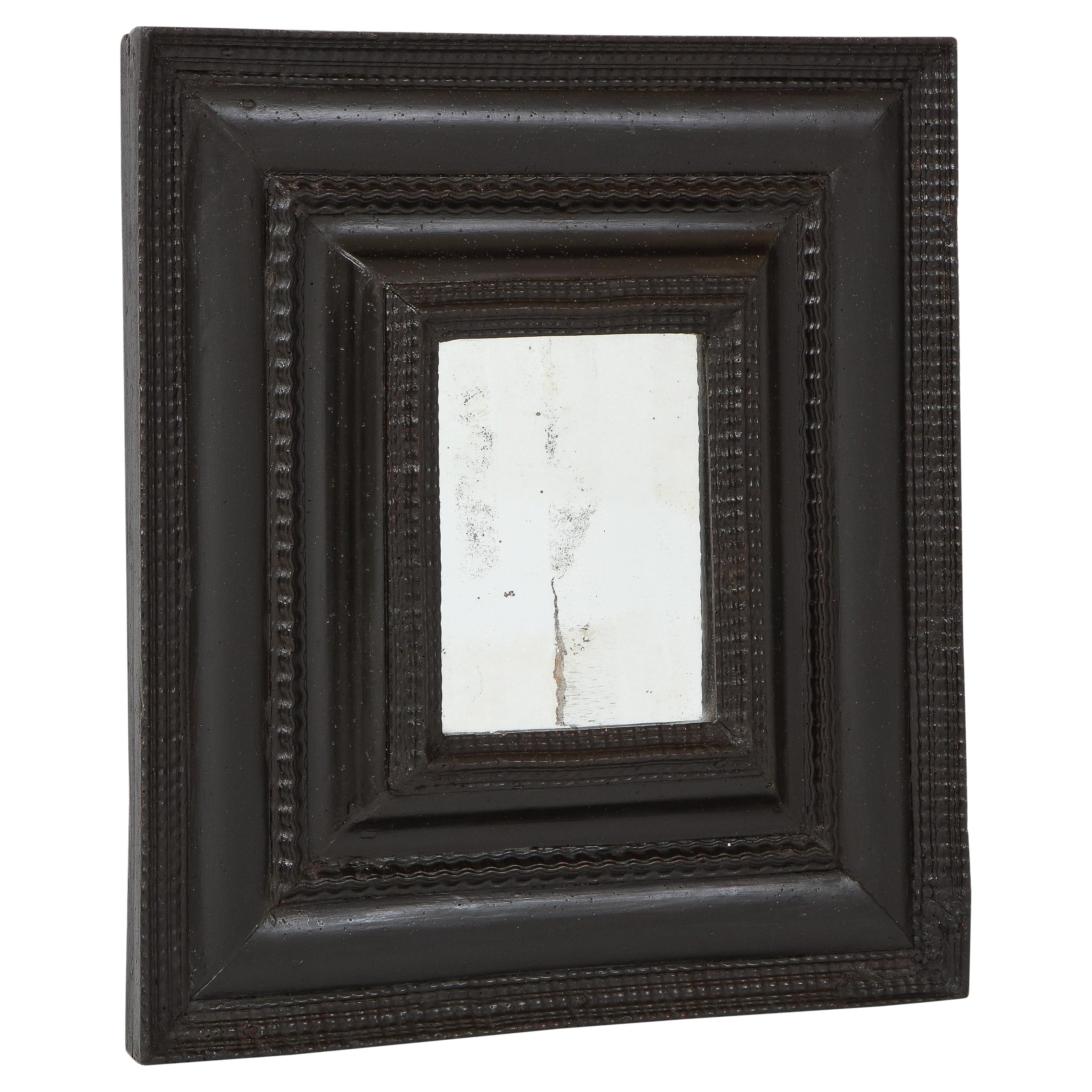 Italian Baroque Ebonized Walnut Guilloché Frame, Inset with Old Mercury Glass