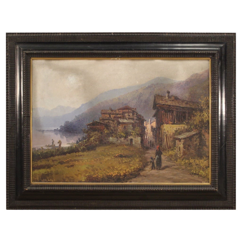 Italian painting from the second half of the 19th century. Framework oil on board depicting a river / lake landscape with a village and characters of good pictorial quality. Guilloché wooden frame carved and ebonized of beautiful decoration. Board