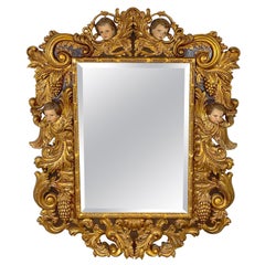 Miroir italien de palace sculpté en bois doré et polychromé de style baroque