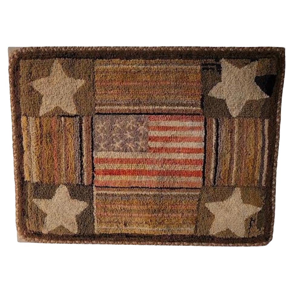 This amazing and historic patriotic mounted hand hooked patriotic flag & stars rug in such fantastic condition. It comes from the famous Charlie Hunter's Americana & folk art collection. This is such an amazing example of folk art and a one of a