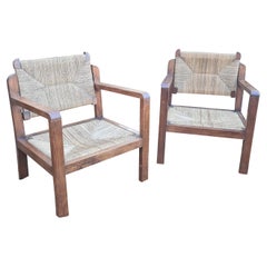 Paire de fauteuils en bois et paille, vers 1960