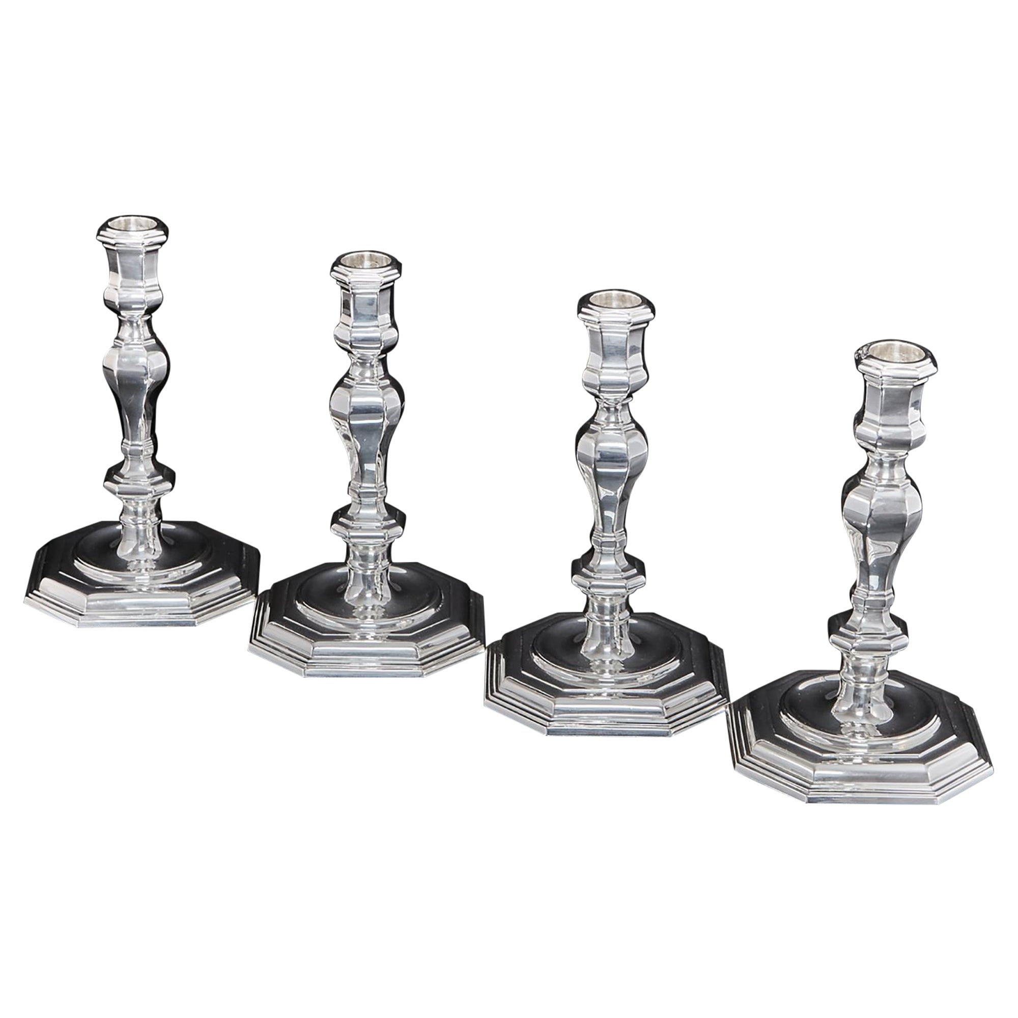 Set of Four Cast Silver Candlesticks