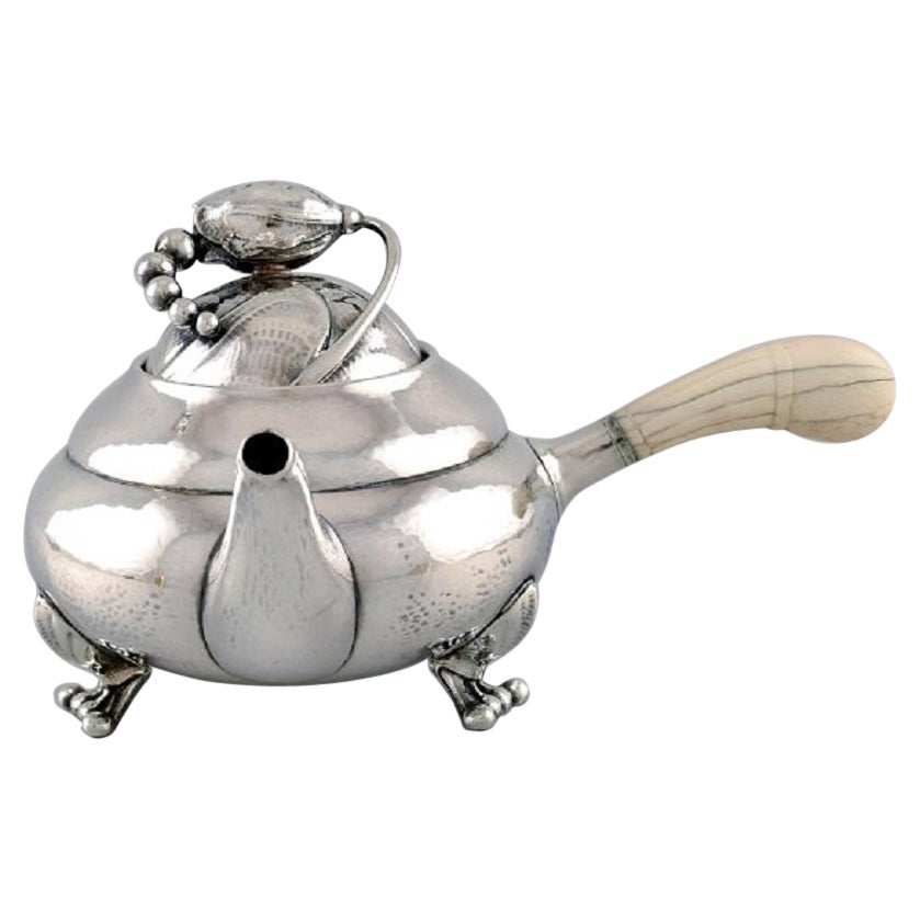 Georg Jensen Blossom Teapot in Hammered Sterling Silver with Ivory Handle For Sale