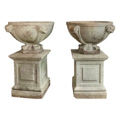Pair of Antique Cast Stone Garden Urns on Pedestals with Fish Motif