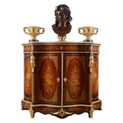 Antique Alexander Roux Serpentine Inlaid Side Cabinet’ Uses Mainly Light Wood Materials