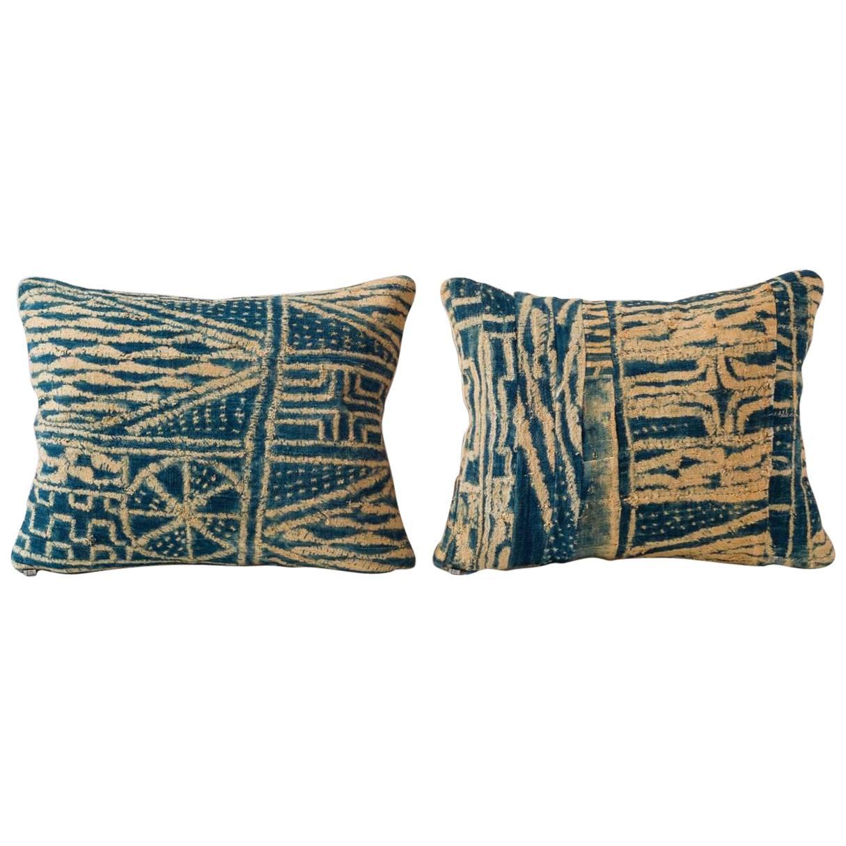 Cushions pieceworked from early 20th century Ndop indigo. Resist dyed cotton from the Bamileke people, Cameroon, Africa. Larger pillows available please send email for inquiry. 

- Linen on reverse--see image
- 75/25 goose feather and down