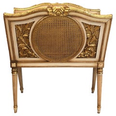 Louis the 16th Style Patinated and Gilded Carved Wood and Caned Magazine Rack