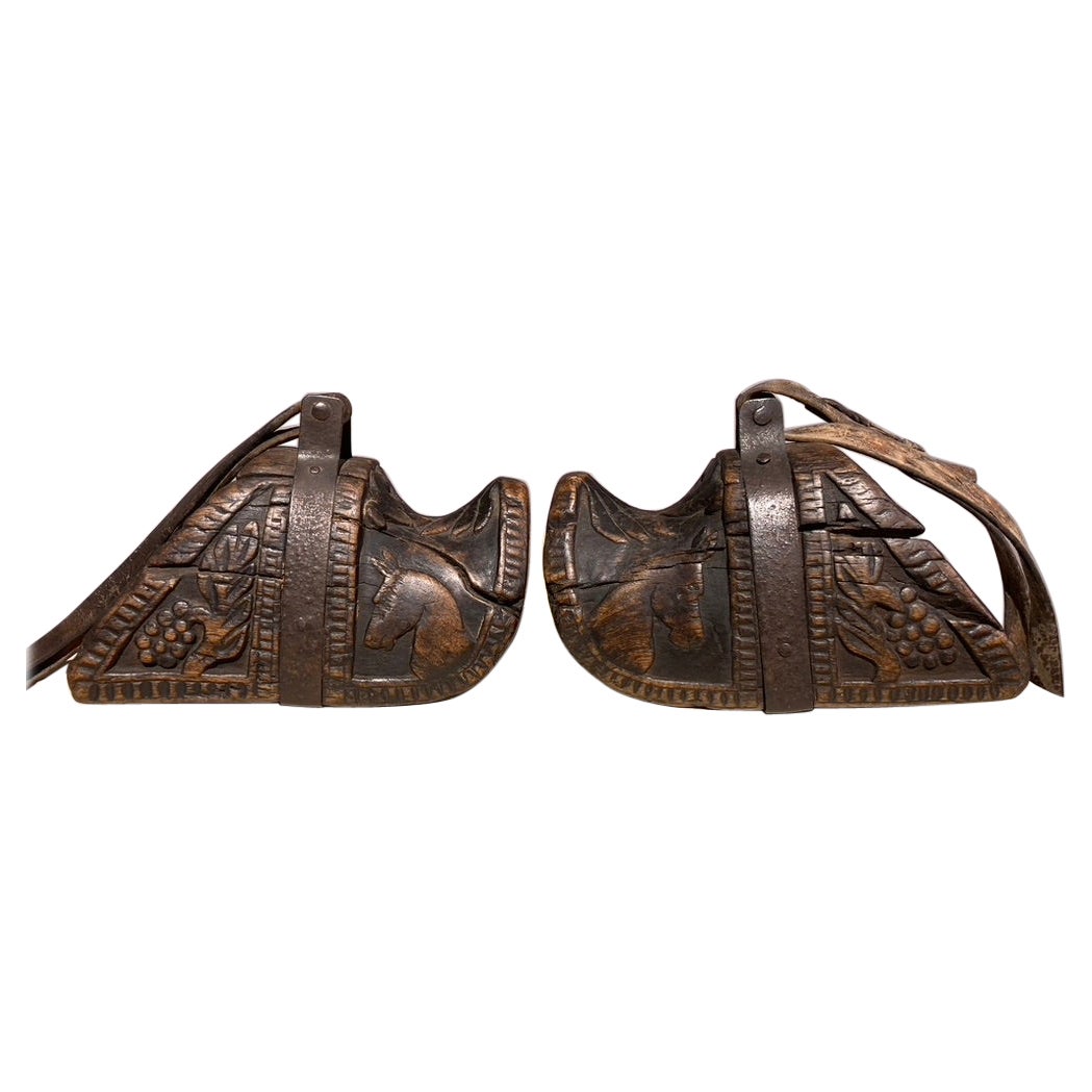 Pair of 19th Century Spanish Colonial Carved Wood and Iron Stirrups