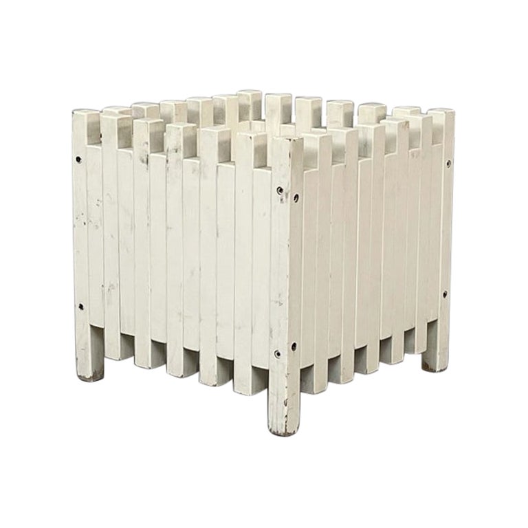 White square planter by Ettore Sottsass for Poltronova, 1961
White square planter composed of rectangular wooden strips painted in white.
Produced by Poltronova in the 1960s and designed by Ettore Sottsass in 1961.

Ettore sottsass produce this