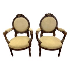 Pair of Ornately Carved Walnut Rams Head Chairs