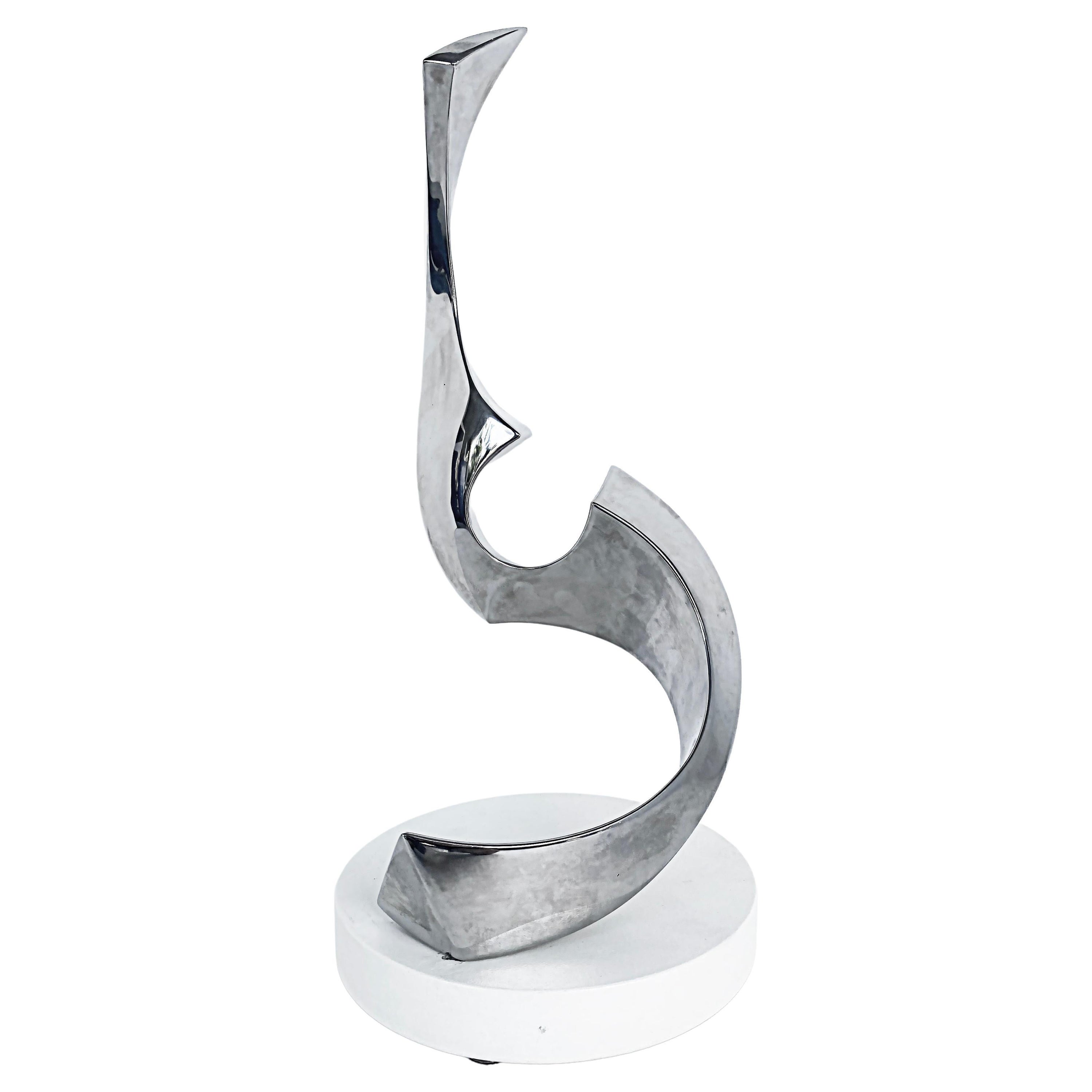Sculpture abstraite chromée sur socle rotatif de Todd Reuben en vente