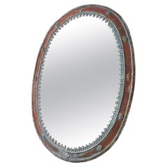 Miroir ovale ancien en zinc et étain